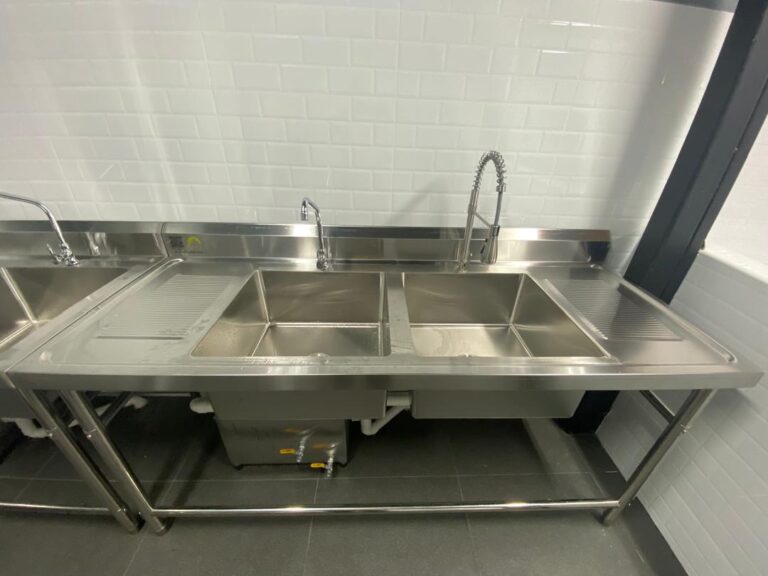 Double bowl sink with pre-rinse tap