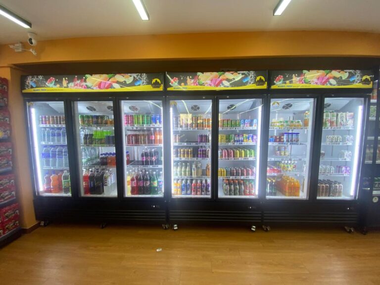 Wall of showcase chillers at Hot Spot Mart