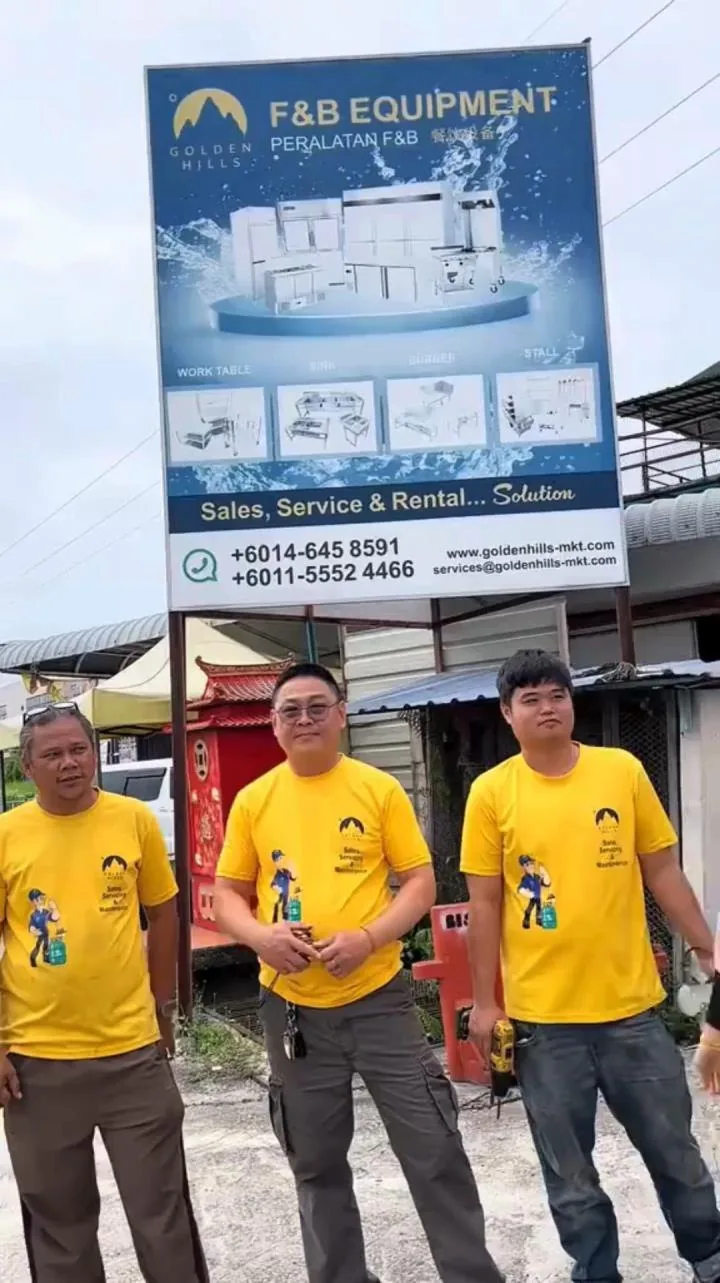 The Golden Hills team in front of the company signboard
